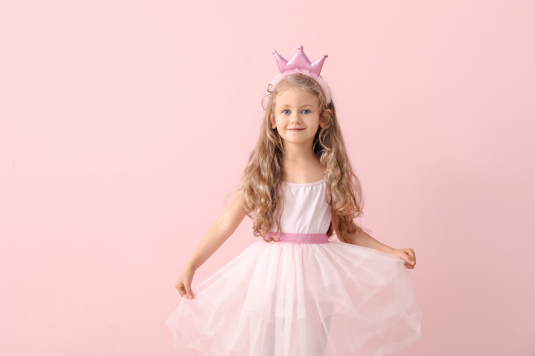 Girl in Princess Costume on Pink Background